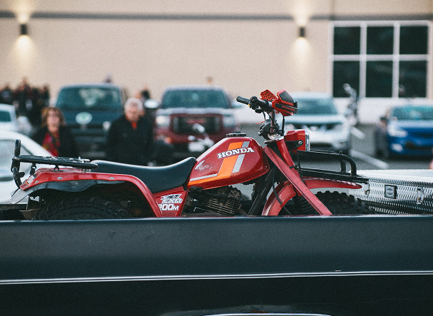 Motorcycle secured for transport in a pickup truck